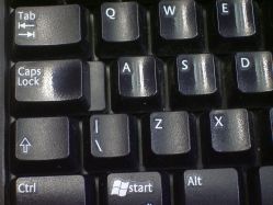 Heavy wear on some keys of a Logitech Y-RJ20; it appears that the previous owner of this keyboard preferred to enter capitals by cycling caps lock instead of pressing shift