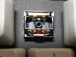 Opened, showing the contact mechanism, tactile leaf and jumper