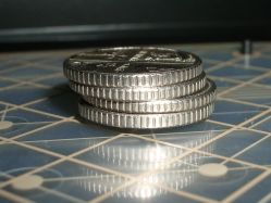 Coins balanced on the concentrator