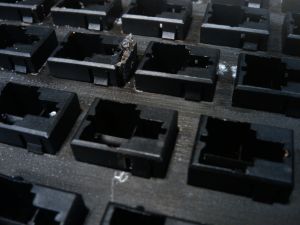 Underside of sliders attached to metal plate.