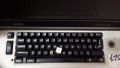 The stem top and keycap mount on a Brother Electronic 8300 typewriter