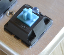 Zorro Blue switch, plate mounted with an LED inserted