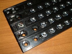Rear of the switch system, showing the conductive feet on the sliders