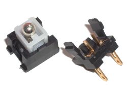 Sanwa SW-68 arcade button switch; note the alternative design involving a guide ramp and tall stationary contacts, and the non-sealed shell