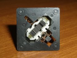 Open position, with the follower arm visible