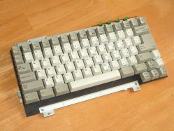 Keyboard assembly; the keyboard is attached to the computer using metal plates screwed onto the PCB
