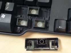 Plastic stabiliser assembly, showing how stabiliser bar attaches to the keycap