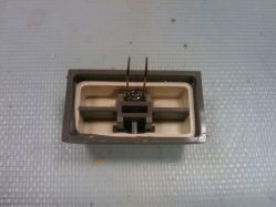 Underside of a Lock keycap with an embedded red LED.