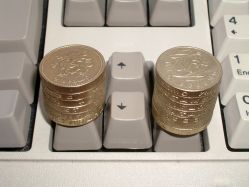 Keys depressed different amounts by different numbers of coins