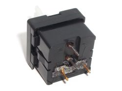 Bottom of the white switch showing the dry foam surrounding the second pair of terminals