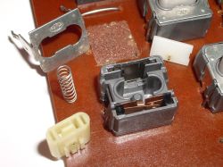 Pin plate removed, to reveal the latch leaf spring