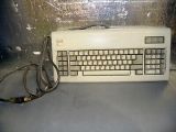 Front-facing angle of the keyboard, showcasing the different badge and nonstandard cable.