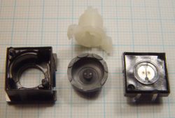 Disassembled; the remains of the sealing lugs are visible on the left