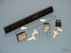 Switch components; note the external return springs and cruciform sliders
