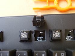 Switches and mounting holes are keyed for correct orientation.