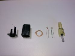 Dismantled switch, notice silver magnet, and the two rubber buffers on the slider (one is holding the spring)