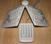 Options by IBM Adjustable Keyboard and Keypad, demonstrating height and angle adjustment.