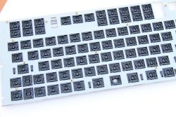 Underside of mounting plate from a short-throw keyboard.